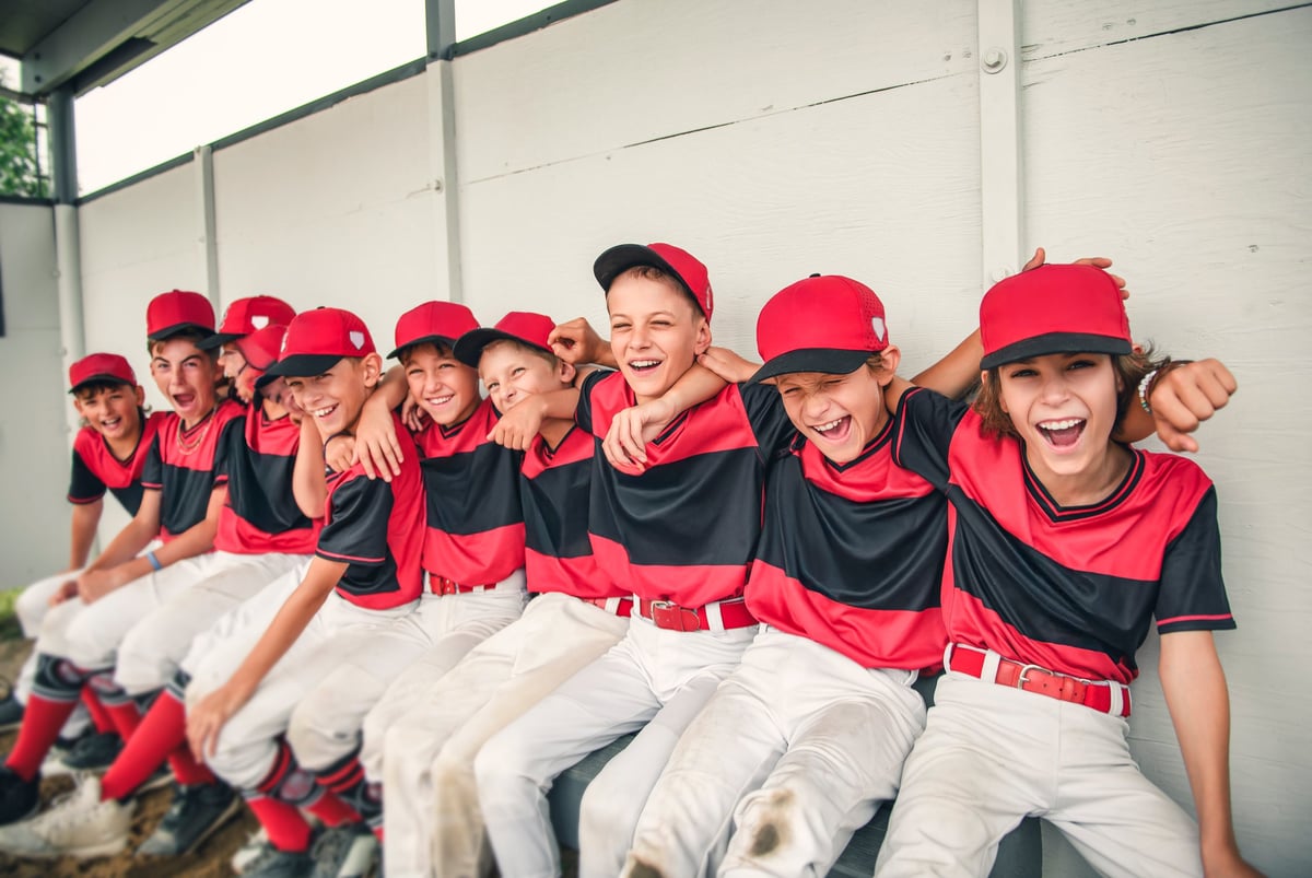Baseball team standing together on the field
