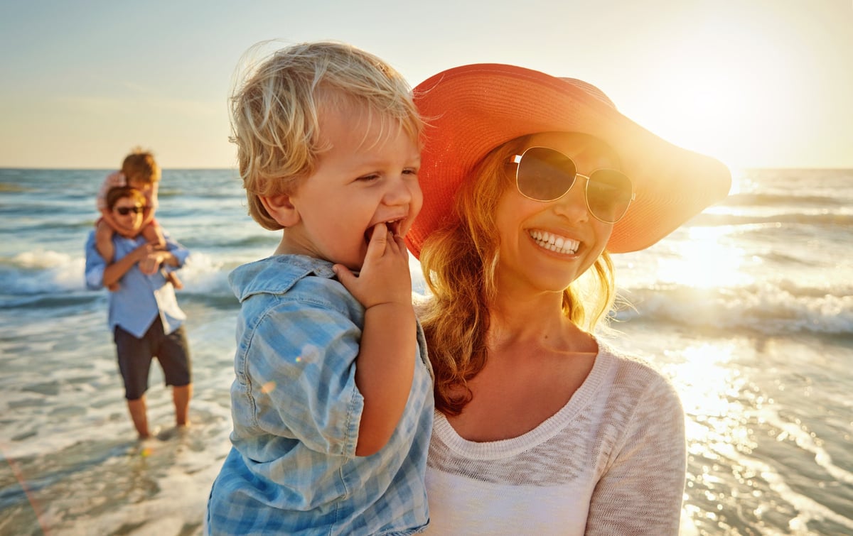 Young family enjoying a day at the beach